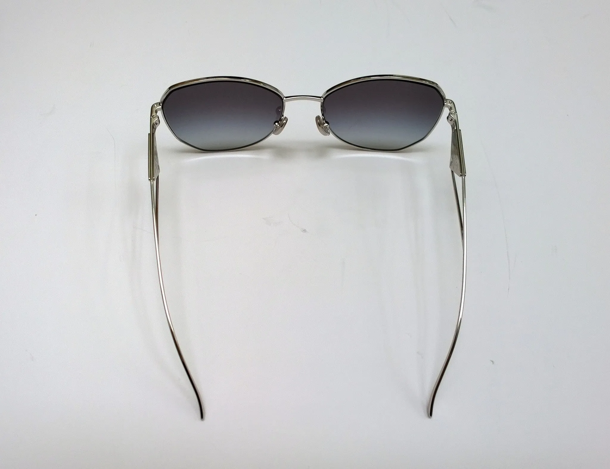 Prada Oversized Geometric Sunglasses in Silver with Triangle Logo Sides